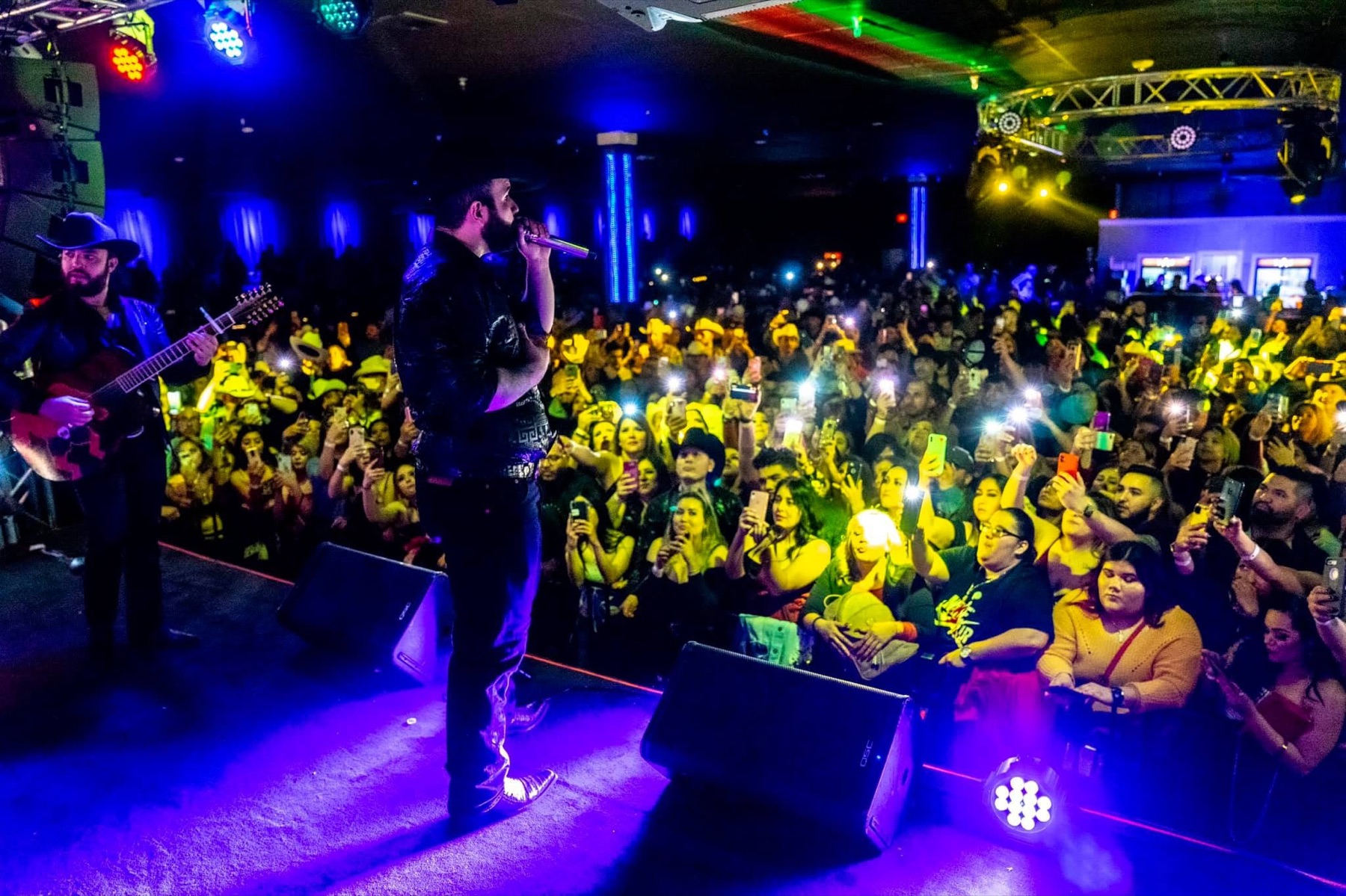 A packed crowd at a live concert at Stratus Event Center